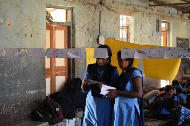 Students of class 11th, reading magazines made by junior students.